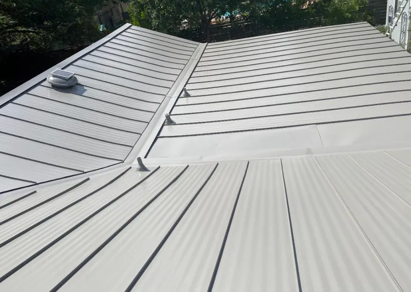 Solar attic fan installed on a metal roof for Roof Ventilation in Port Sheldon